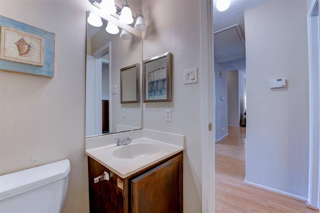 Well-positioned full bathroom just off the hallway—convenient access for secondary bedrooms and guests alike.