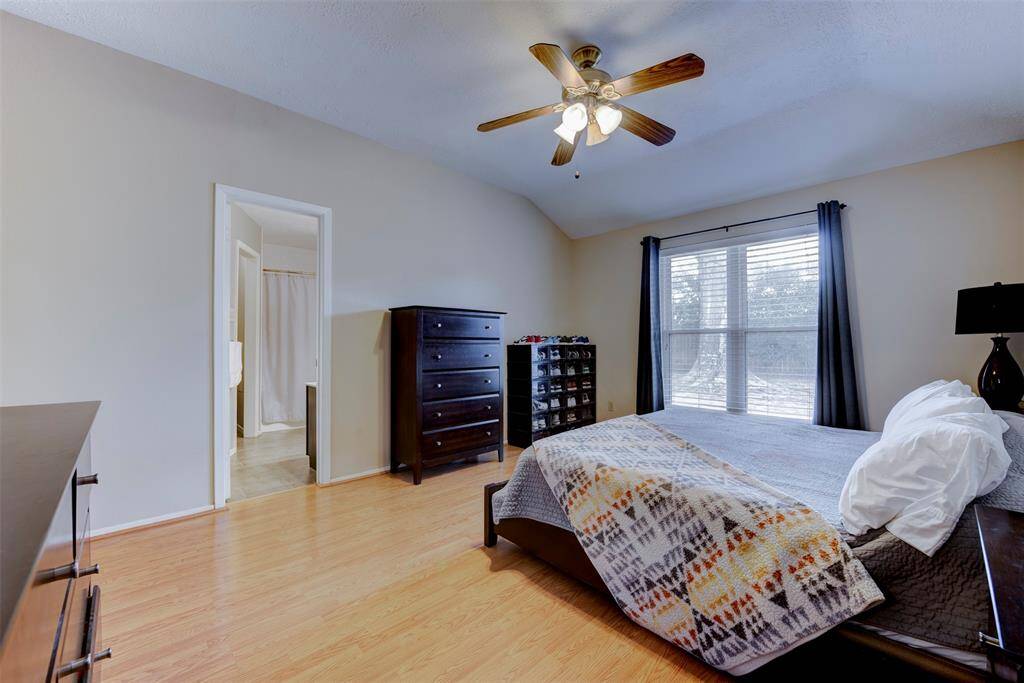 An alternate angle reveals direct access to the spacious ensuite bath, offering convenience and privacy for the owner. The layout enhances the flow between the bedroom and bathroom, creating a seamless retreat.