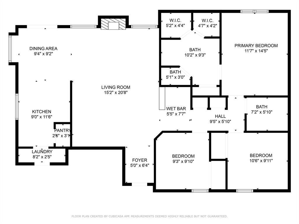 Spacious floorplan with generous room dimensions, an open-concept dining and kitchen area, and a large central living space anchored by a cozy fireplace.