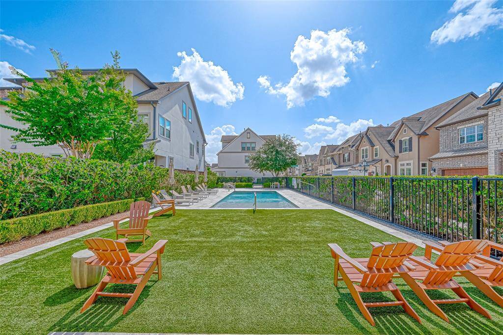There is a grassy area next to the community pool where you can relax or meet new neighbors.