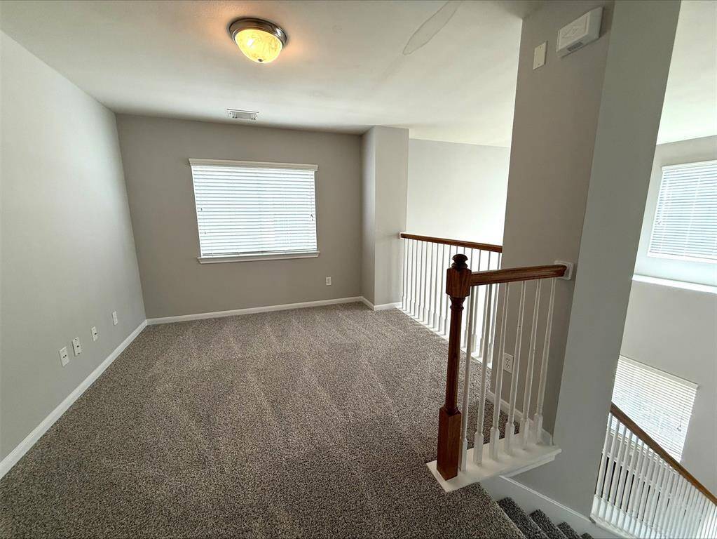 Lofted game room at top of stairs.