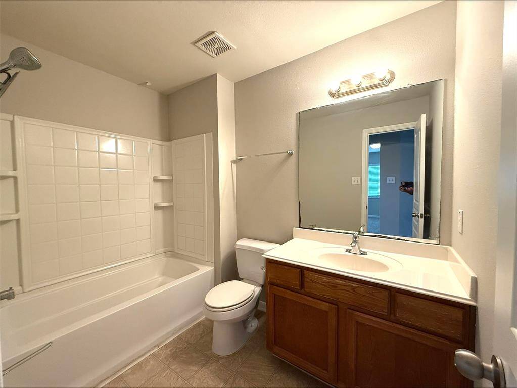 Full bath upstairs with tub and shower combination.
