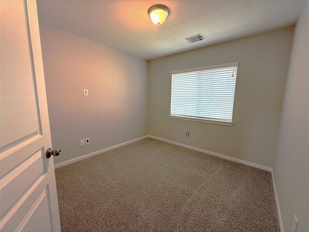 Bedroom up with new carpeting.
