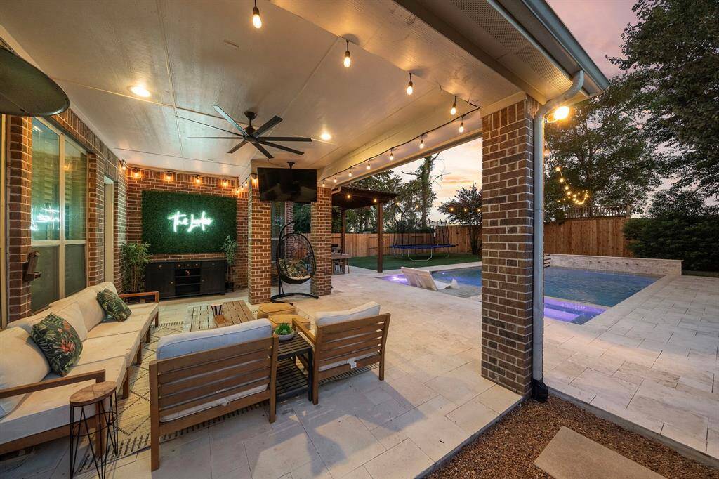 Beautifully designed patio area with elegant pavers perfect for relaxing under the shade.