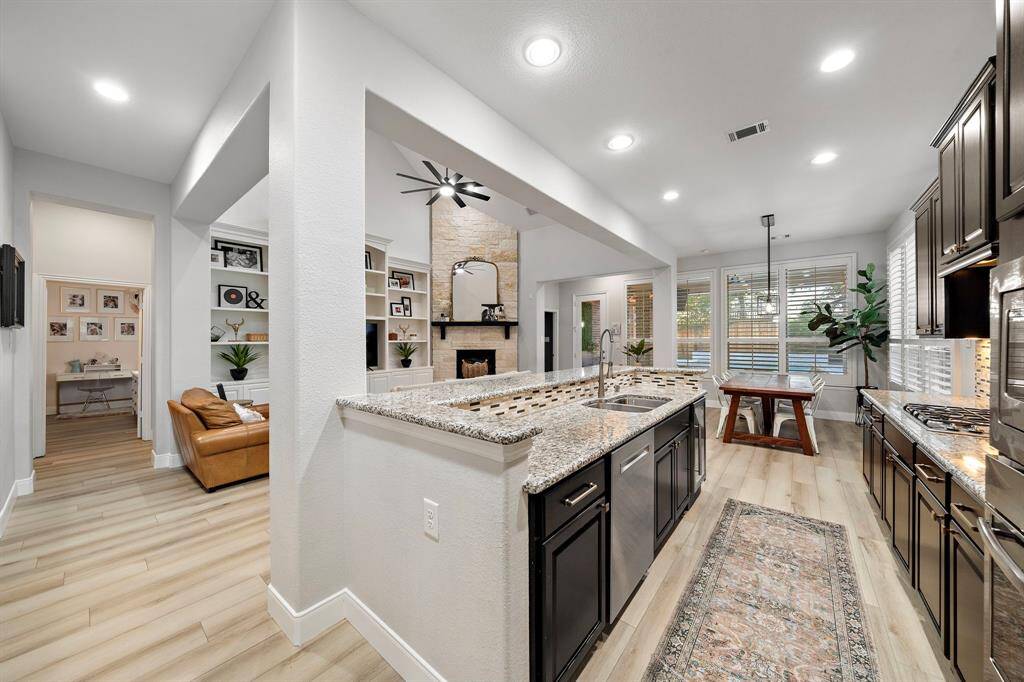 With its open-concept design, the kitchen becomes the heart of the home, offering unobstructed views of the living and dining areas.
