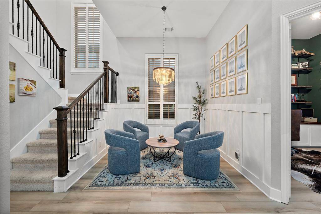 The entryway flows effortlessly into the formal sitting area, creating a smooth transition between spaces.
