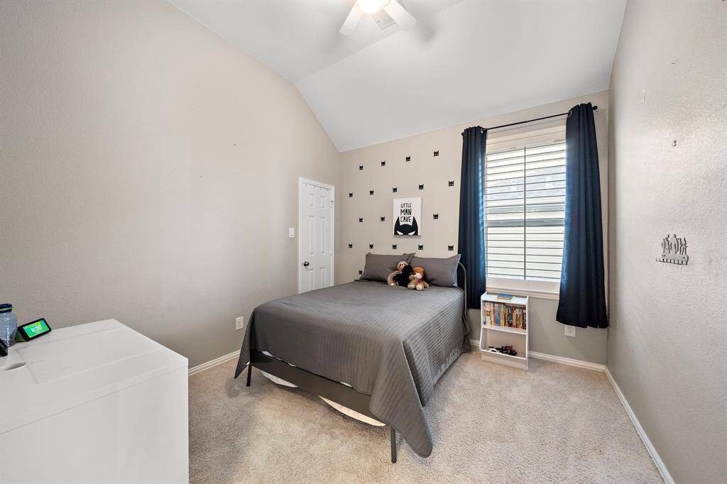 Secondary bedroom offers privacy and comfort with a neutral palette