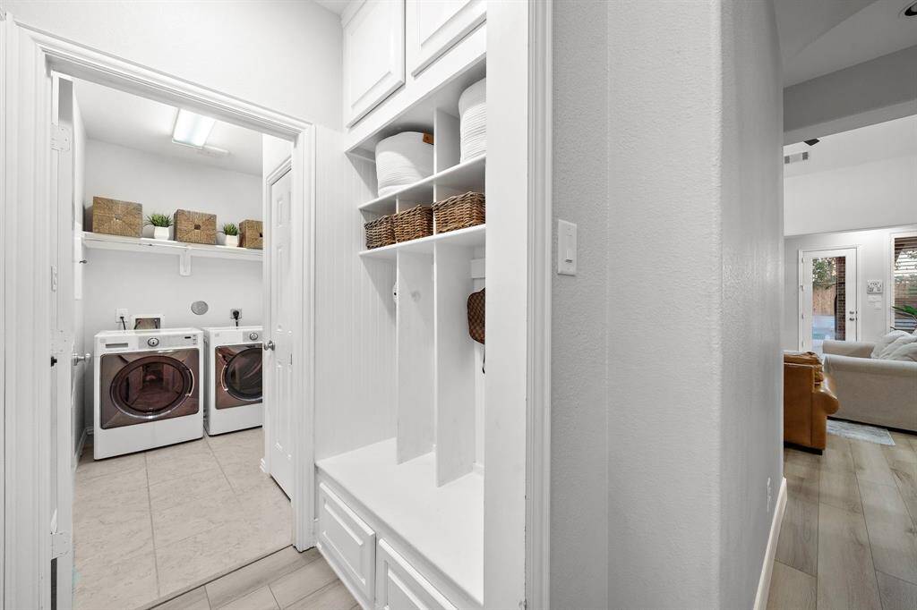 Stylish and functional, the mudroom includes ample cubby space and sleek finishes.