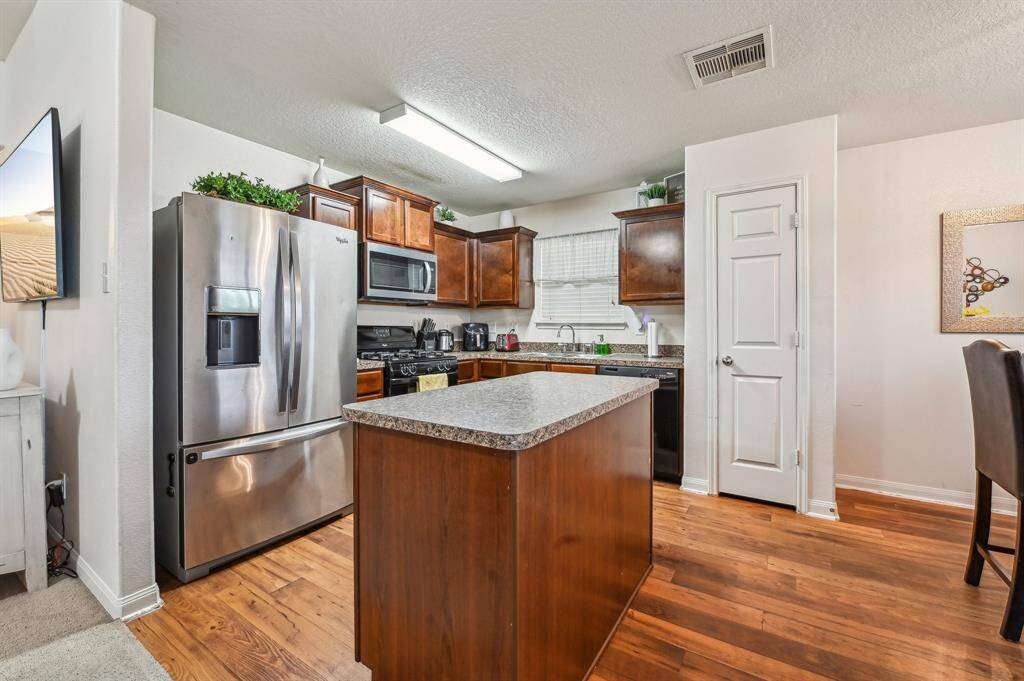 Kitchen is compact yet highly efficient, thoughtfully design to maximize every inch of space