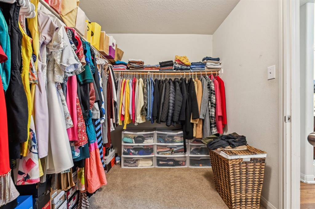 Master closet that is generously sized and thoughtfully organized, offering ample space for clothing, shoes and accessories