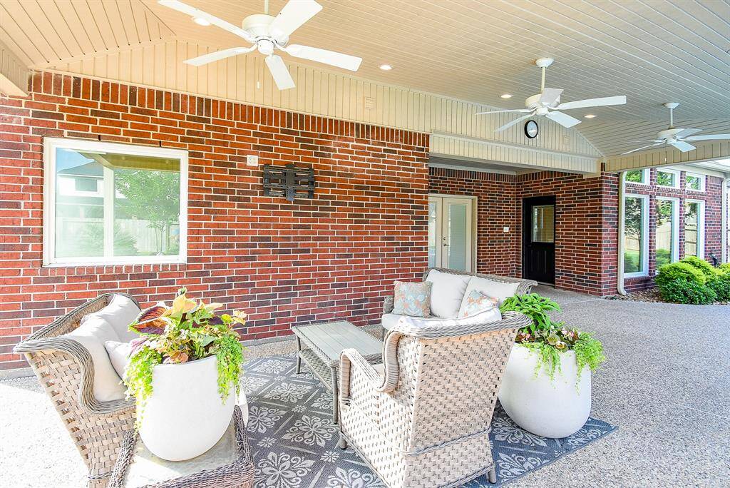 Lounge by your resort style pool under the covered patio while relaxing and watching TV.