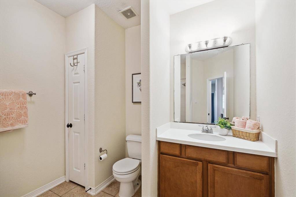 One of two full bathrooms upstairs featuring a convenient tub/shower combo, perfect for everyday use or guests. Includes a built-in linen closet for extra storage and organization.