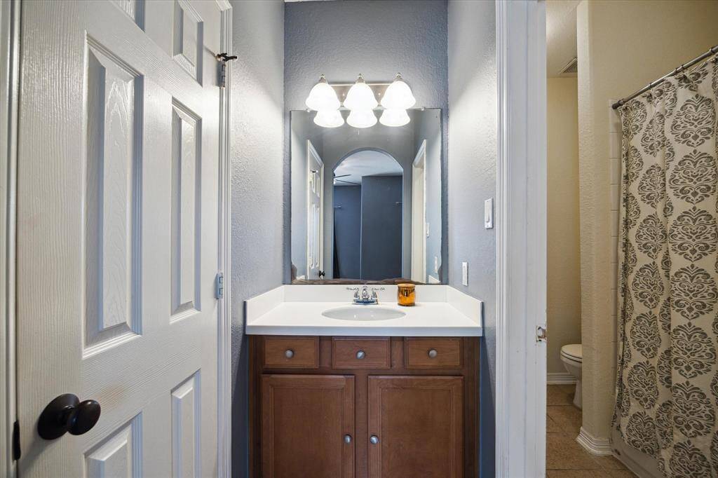 Private vanity area of the Jack and Jill bathroom connected to the third upstairs bedroom, offering personal space  and direct access to the shared tub/shower. Perfect blend of privacy and convenience.