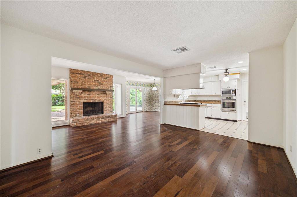 Past the living room is the lovely family room/den which opens up to the kitchen.