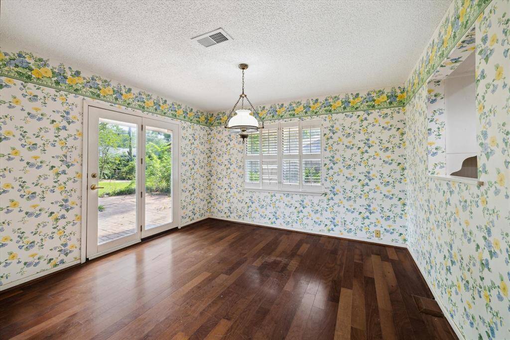 This breakfast/dining room has a lovely view of the backyard.