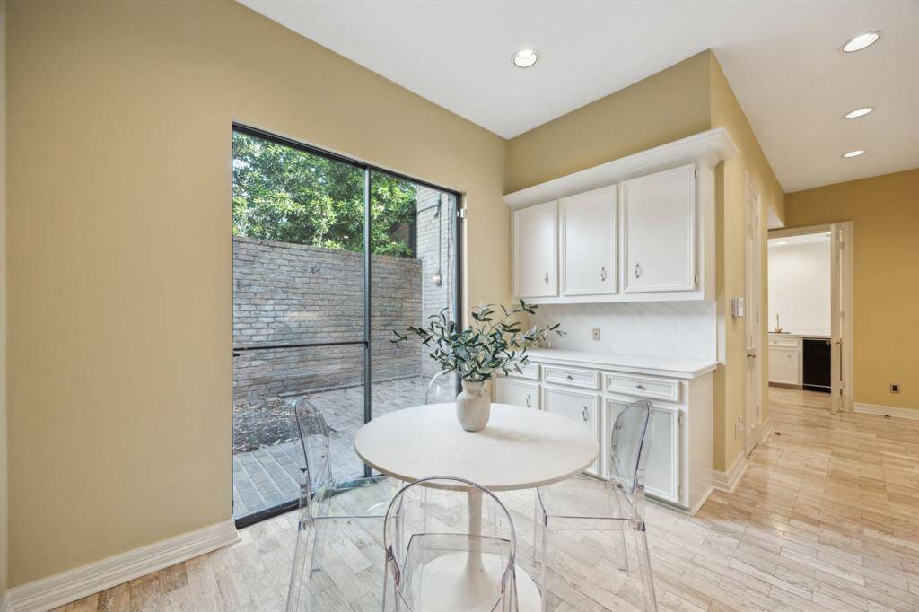 Breakfast room provides access to one of the outdoor living areas.
