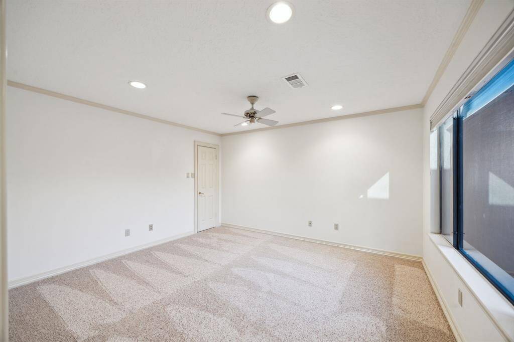 One of two secondary bedrooms with freshly shampooed carpet, recessed lighting, window coverings, and en-suite bath.