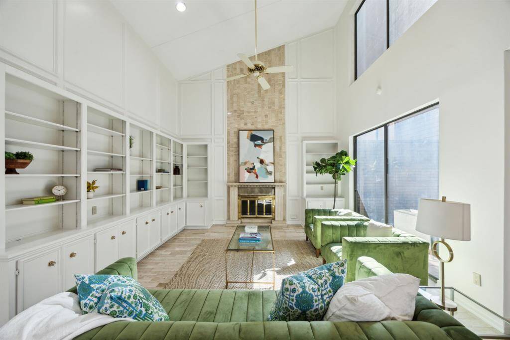 Living room is enhanced by high ceilings and tons of natural light.