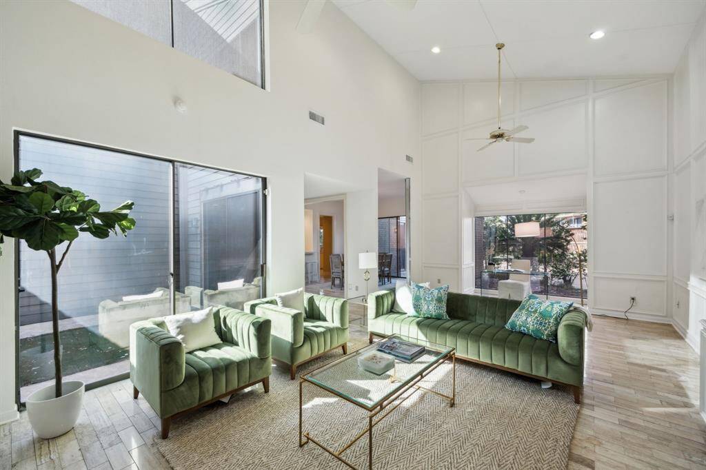 Another view of the living room showing access to the turfed patio space.