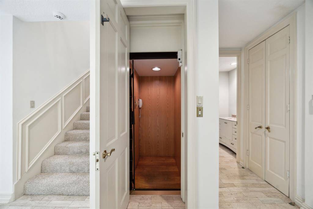 Elevator for additional convenience is located just off the entry. Powder bath is down the hall to the right.