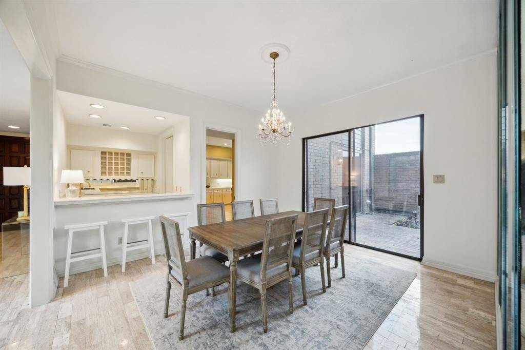 Formal dining room with wet bar and access to both patios.