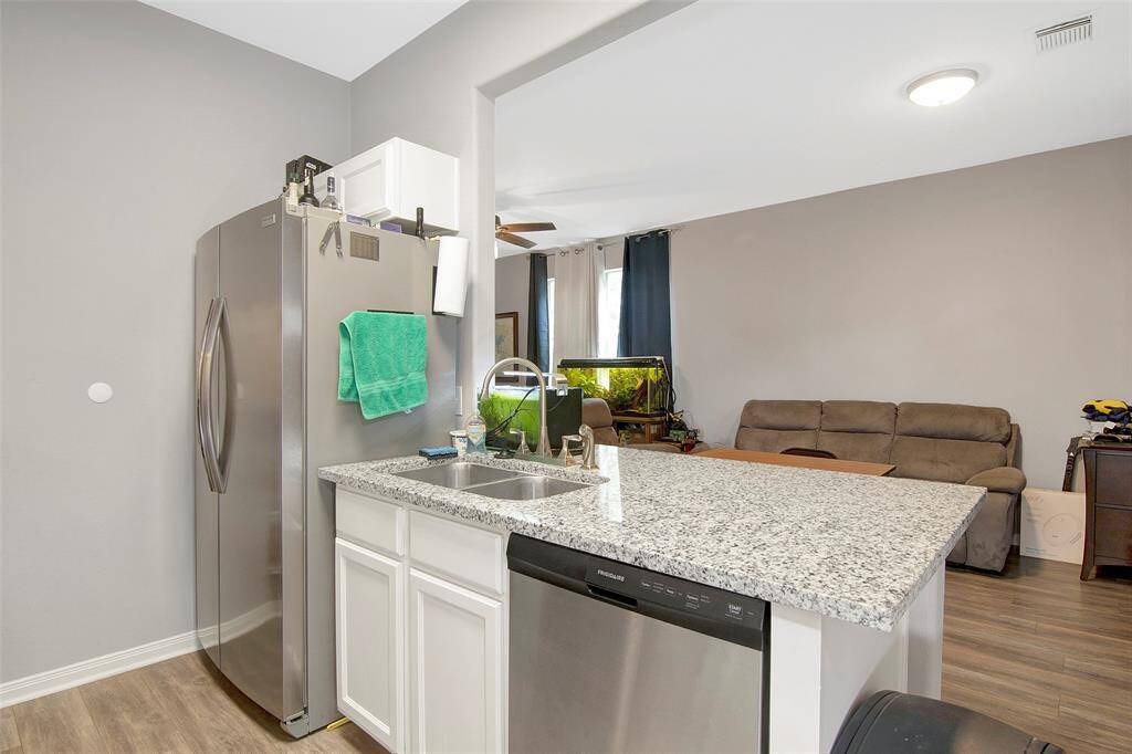 Kitchen is open to the living area and ideal for enjoying guests.