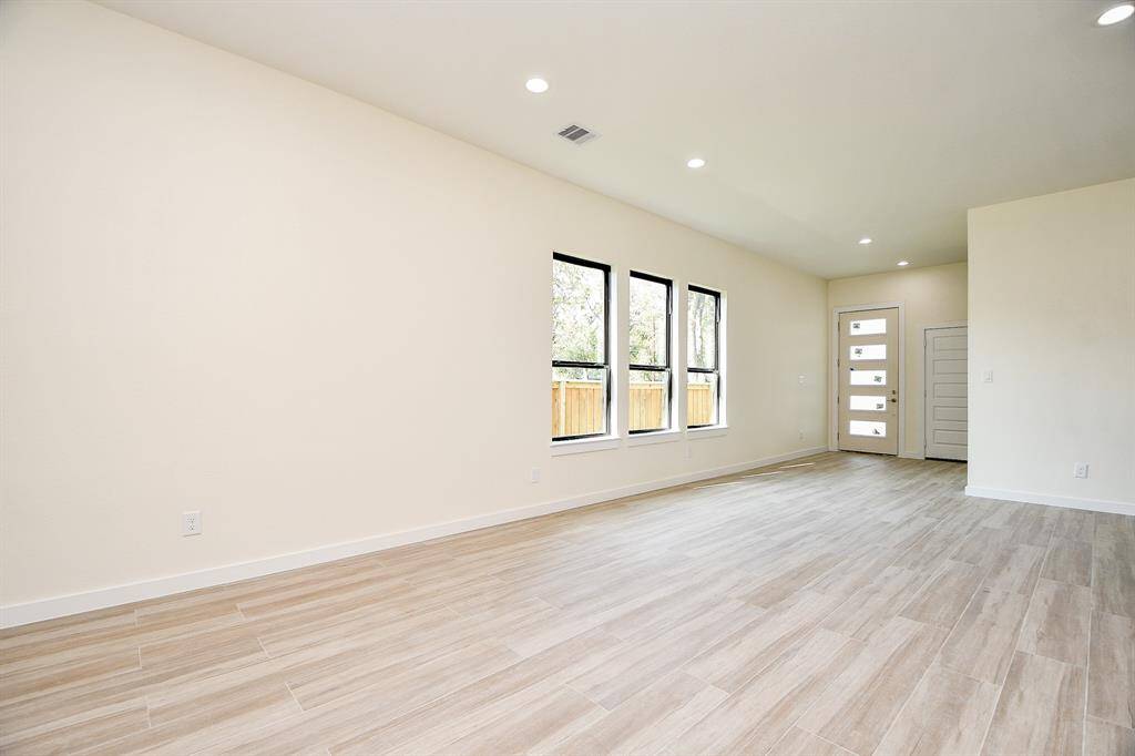Upon entering you find beautiful floors, high ceilings, and ample recessed lighting!