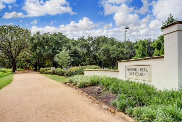 The peaceful path leading to Memorial Park Golf Course offers a quiet escape surrounded by mature trees and greenery. This highly rated public course blends nature and recreation just minutes from the heart of the city.