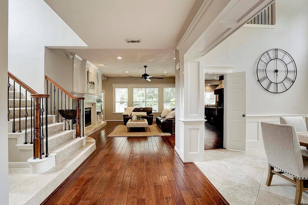 Just inside, a flowing, open floorplan is revealed.