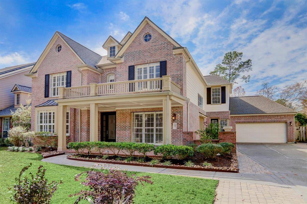 Great curb appeal and southern charm extends past the front veranda all the way up the driveway to the side patio-there are multiple places for outdoor living in this lovely home.