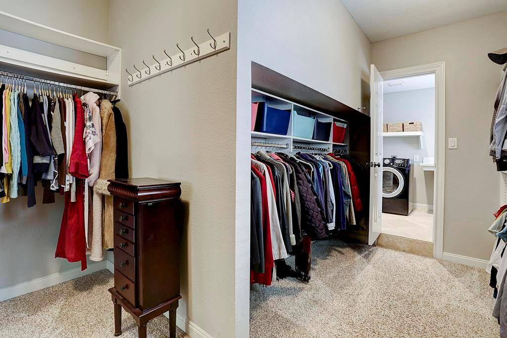 The spacious master closet also has access to the laundry room, a coveted design feature.