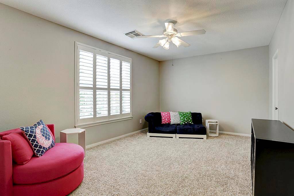 This enormous room is yet another secondary bedroom, presently being used as a play room.  It enjoys a walk in closet and full bath.