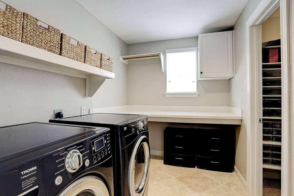 This light and bright laundry room may actually make doing laundry a pleasure!  It conveniently connects to the first floor master. Washer & Dryer non included.