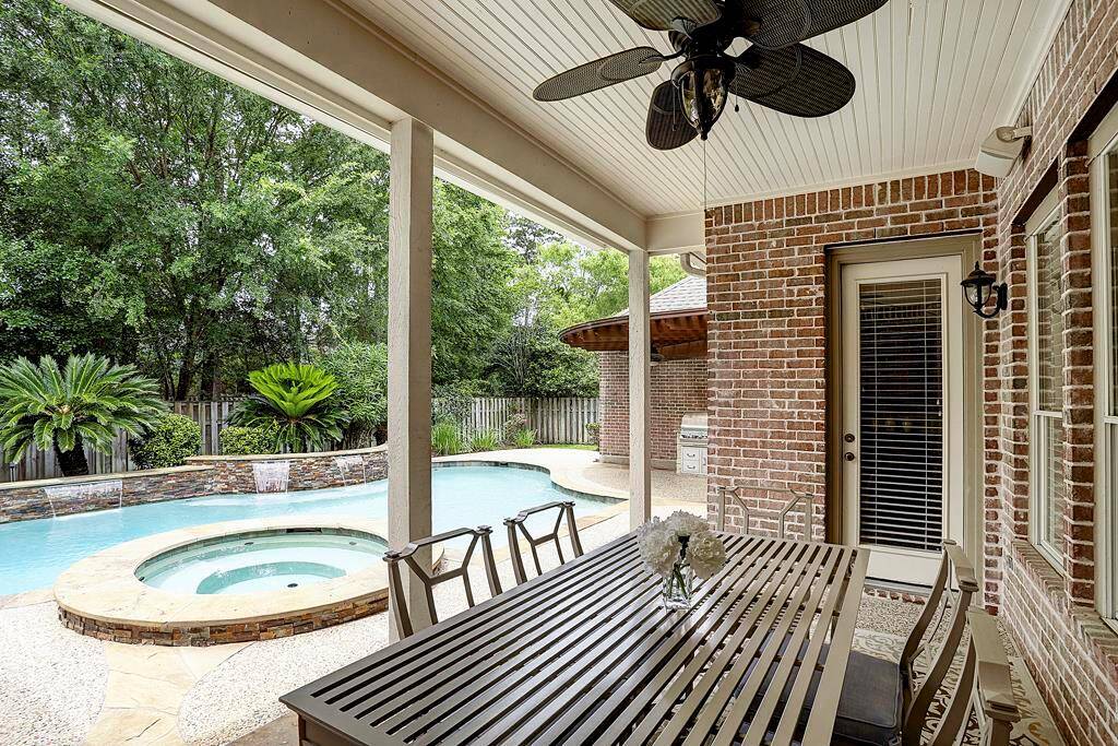 The backyard features two distinct covered areas for outdoor entertaining.