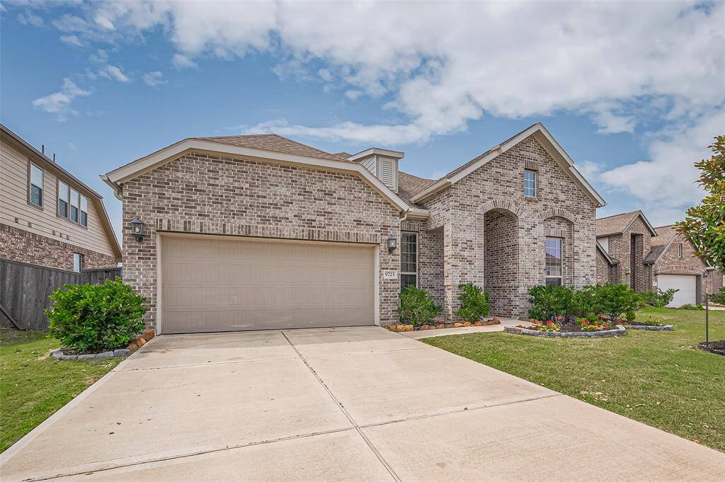 his impeccably maintained single-story home offers a spacious three-car tandem garage, ideal for multiple vehicles or added storage. With brick on all four sides, the exterior exudes both durability and classic charm. A neatly landscaped front yard and arched entryway enhance its inviting curb appeal.