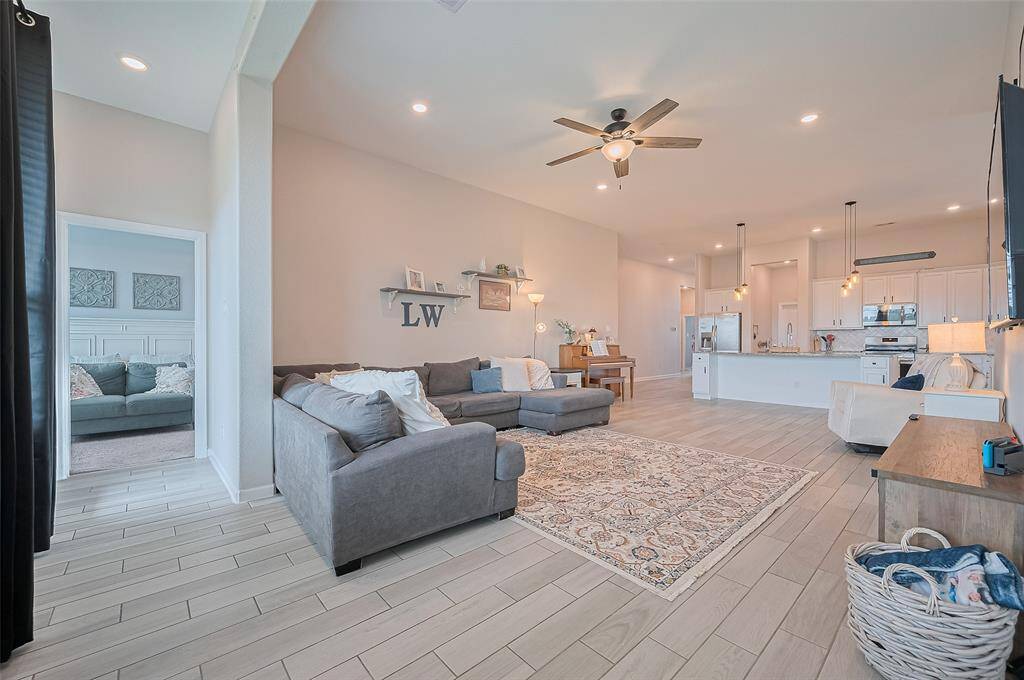 Open-concept layout seamlessly connects the living room to the kitchen, creating a spacious flow ideal for everyday living and entertaining.
