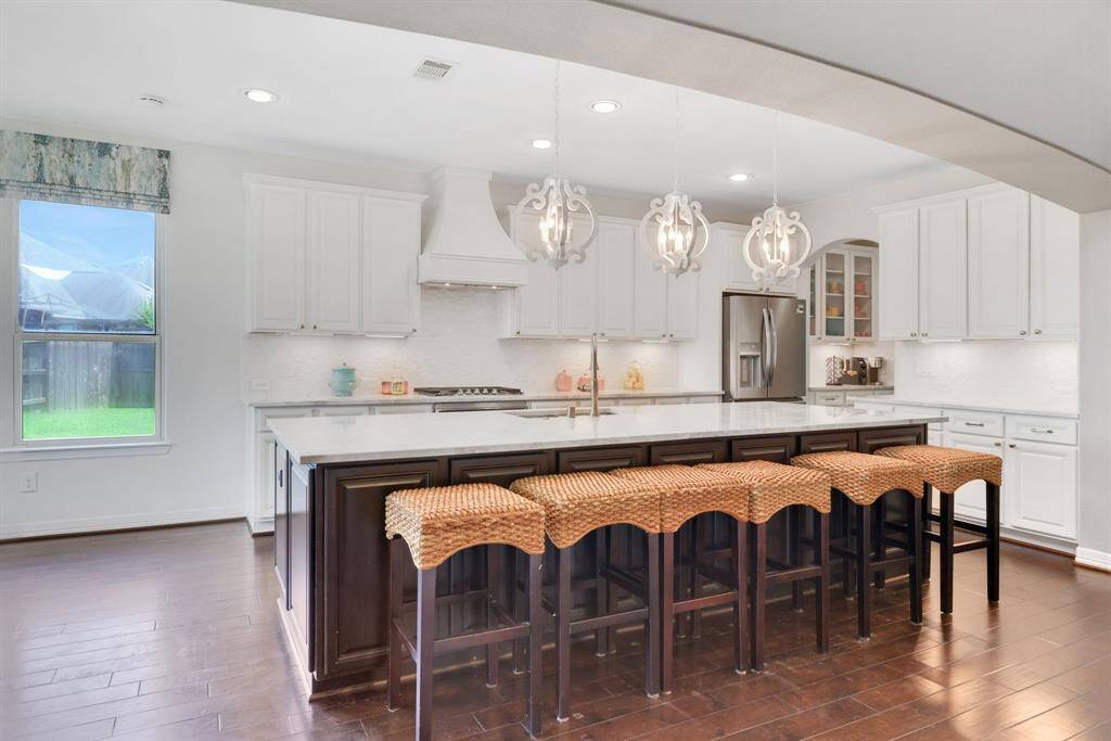 Gourmet kitchen with sleek granite counters, stainless steel appliances, and plenty of storage space