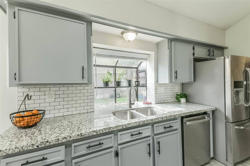 The garden window over the sink is the perfect place for growing your own herbs.