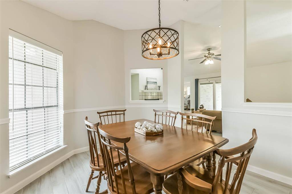 Formal dining is light and bright with its corner window and openings to the living room.
