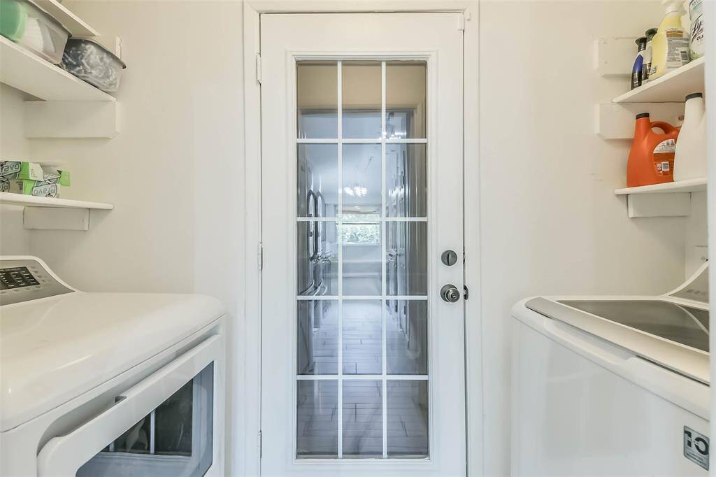 Convenient laundry room is directly off of the kitchen with a French door leading to the 2 car garage.