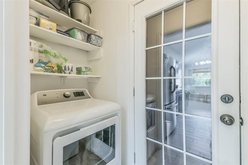 Lots of extra storage space in this convenient inside laundry room.