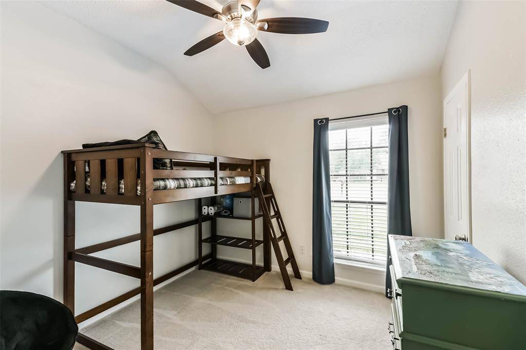 Bedroom two with ceiling fan and large closet.