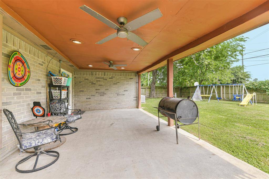 This large covered back porch provides plenty of space for entertaining.