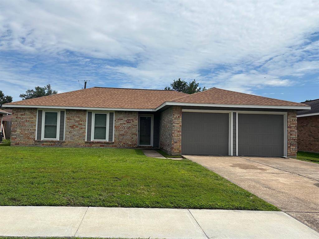 Welcome Home to this is a single-story brick home with a two-car garage.