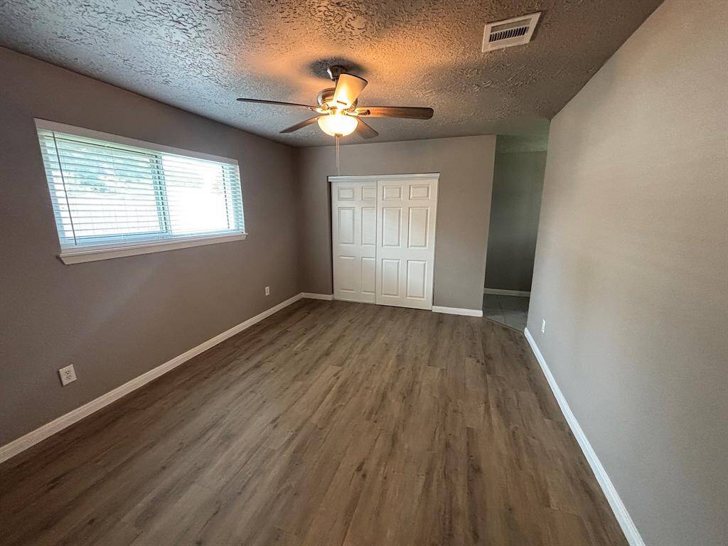 Another view of the primary bedroom.