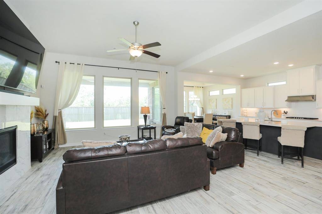 Family room that is open to the kitchen and has plenty of natural light.