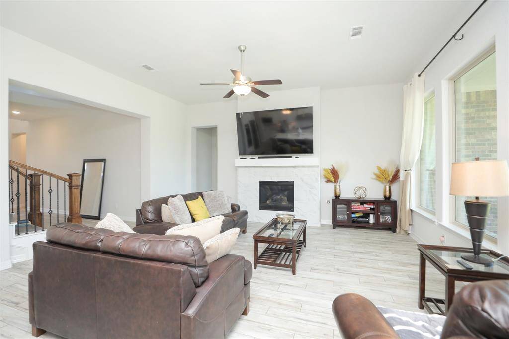 Family Room complete with a Fireplace for those cold nights while watching your favorite TV show.