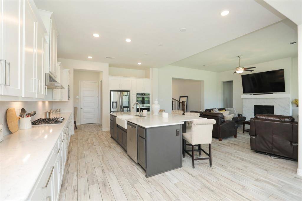 Open concept and tile floors that look like wood