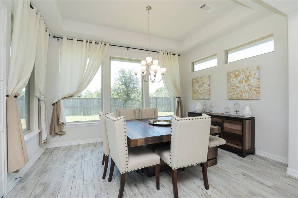 Dining area overlooks the spacious back yard.