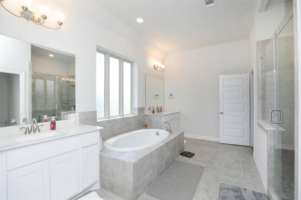 Second Primary Bathroom upstairs with soaking tub and separate shower.